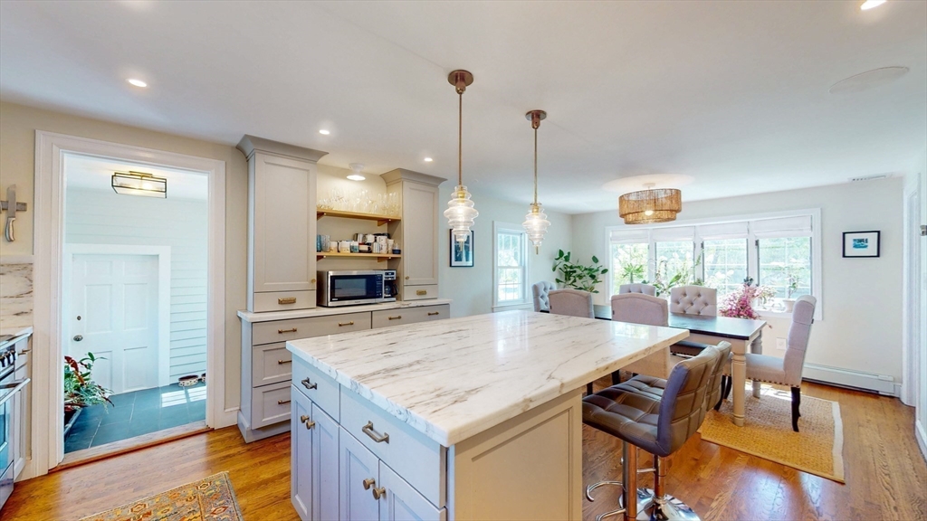 49 Ripley Road Medford, MA 02155 - Photo 8 of 27 a kitchen with a table and chairs in it