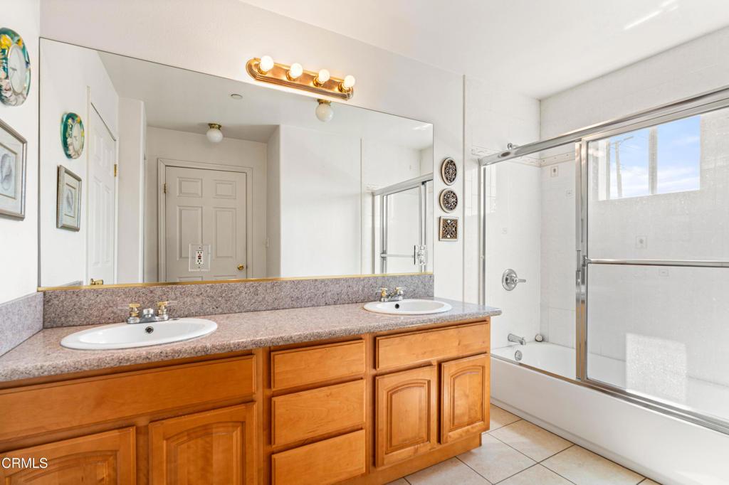 907 West Mission Road, Unit B Alhambra, CA 91801 - Photo 20 of 27 a bathroom with a granite countertop sink mirror and a shower