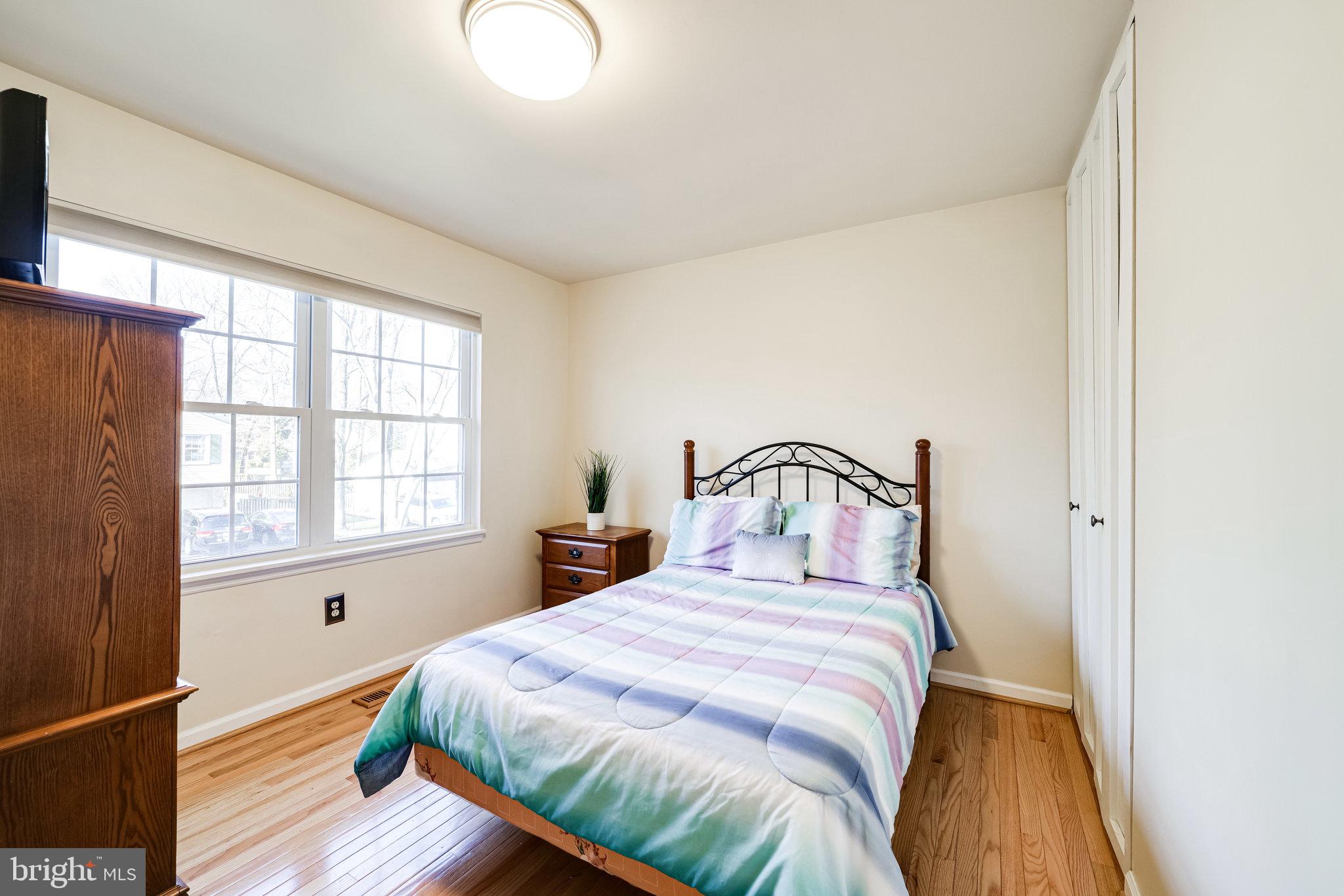 10177 Marshall Pond Road Burke, VA 22015 - Photo 24 of 66 Main lvl bedroom has hardwood floors & new light