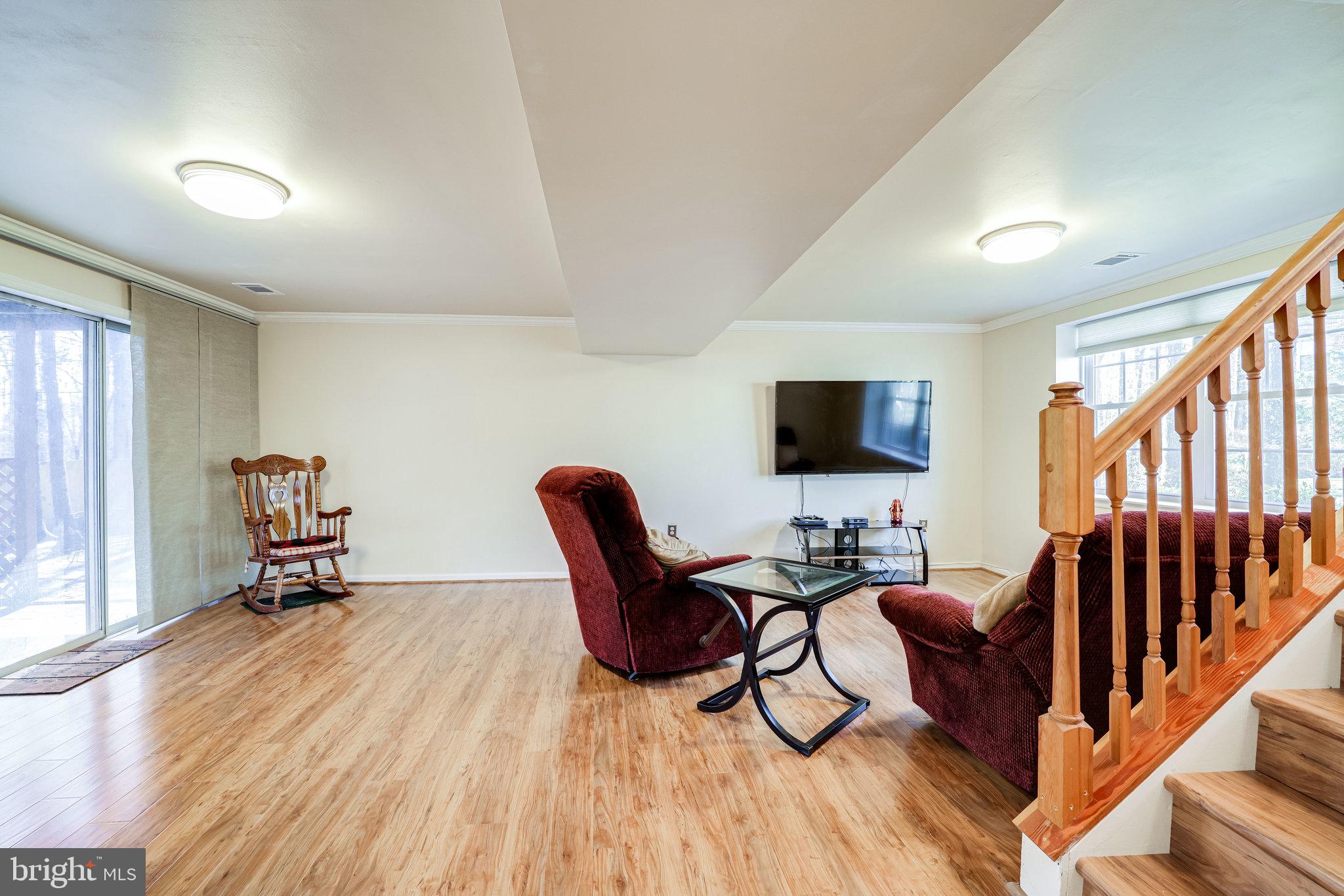 10177 Marshall Pond Road Burke, VA 22015 - Photo 35 of 66 Lower level rec room with new waterproof flooring