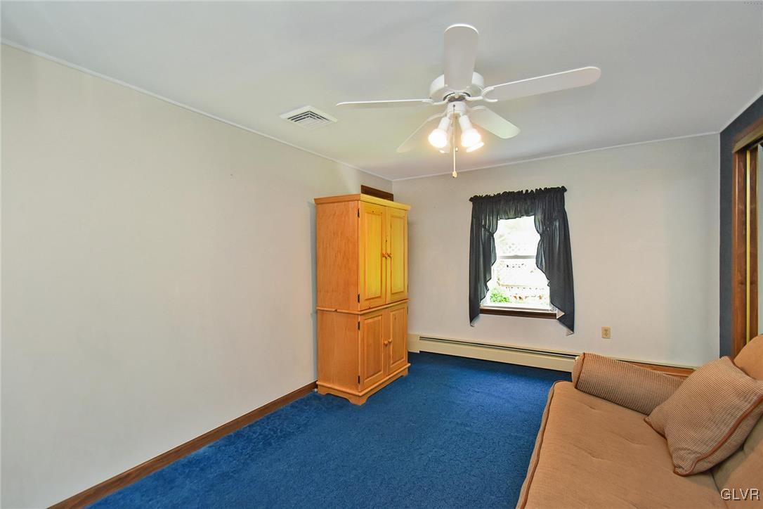 3015 Mountain Road Slatington, PA 18080 - Photo 20 of 32 an empty room with wooden floor fan and windows