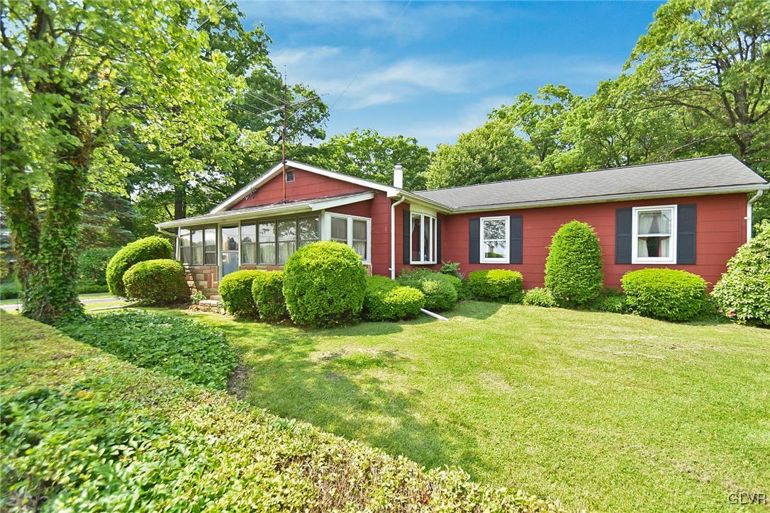 3015 Mountain Road Slatington, PA 18080 - Photo 2 of 32 a view of a house with a yard and plants
