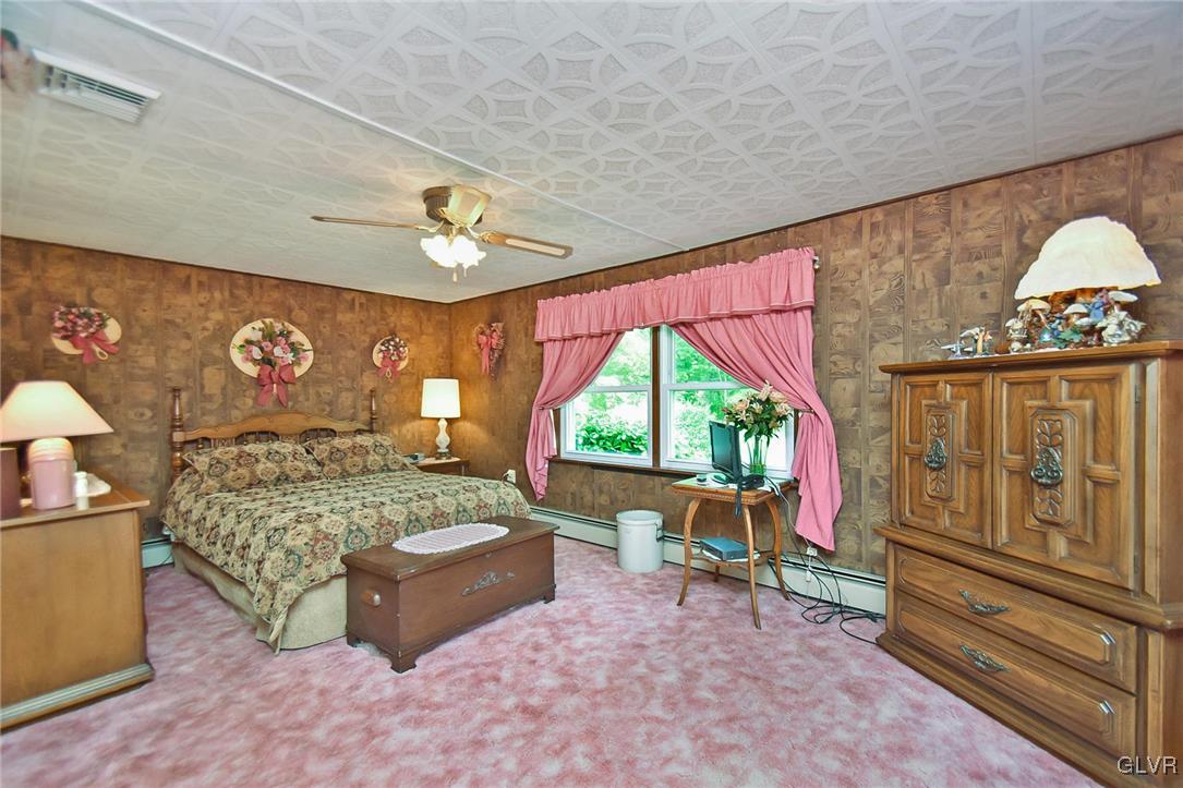 3015 Mountain Road Slatington, PA 18080 - Photo 22 of 32 a bed room with a bed and a two large window