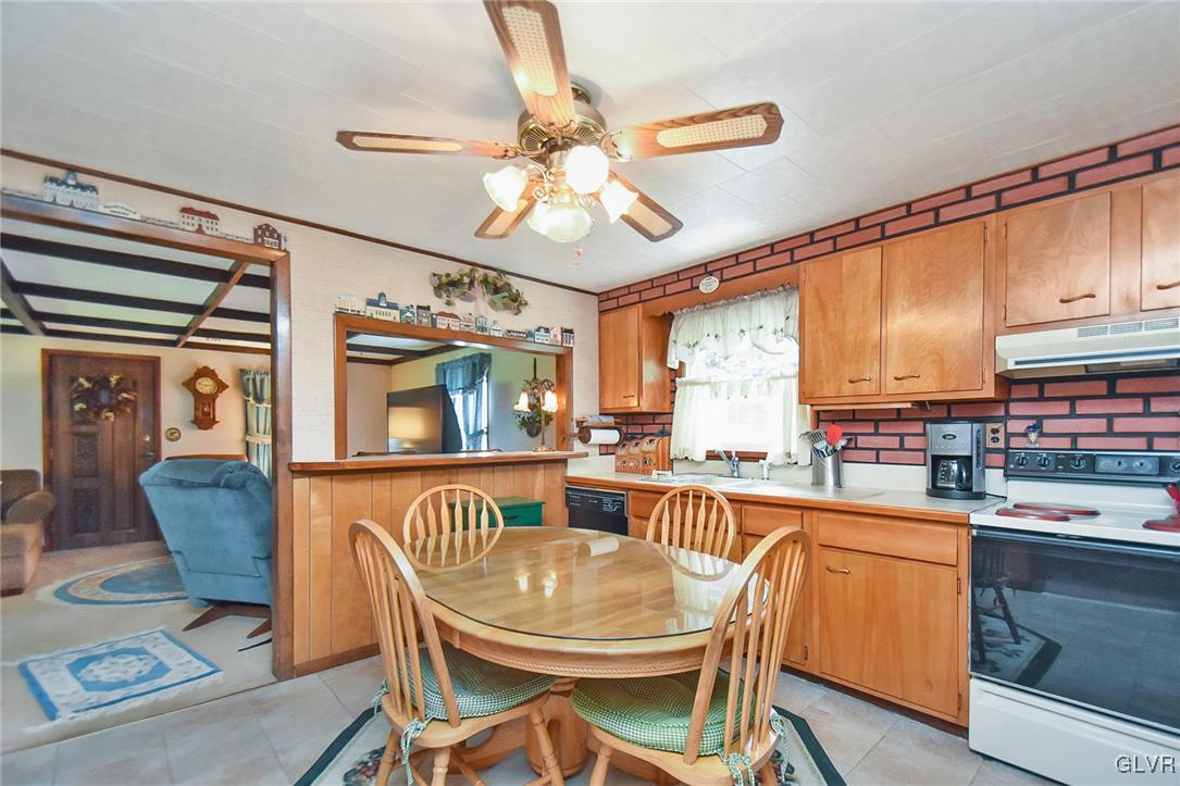 3015 Mountain Road Slatington, PA 18080 - Photo 10 of 32 a dining room with furniture a chandelier and wooden floor