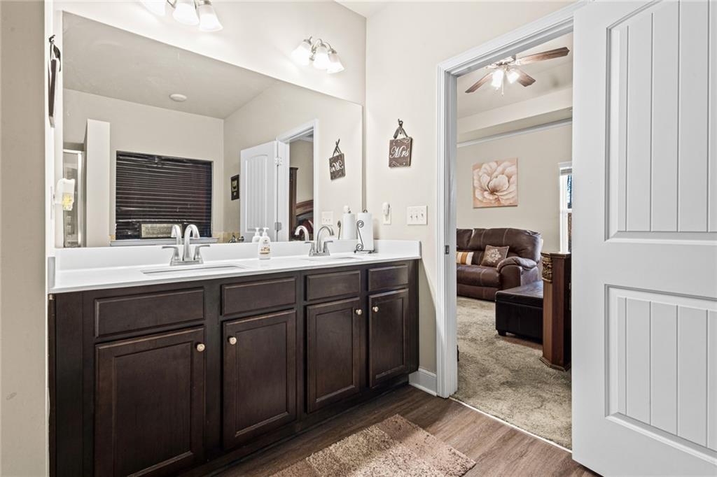 61 North Village Circle Rydal, GA 30171 - Photo 11 of 18 a en suite bathroom with a double vanity sink and a mirror