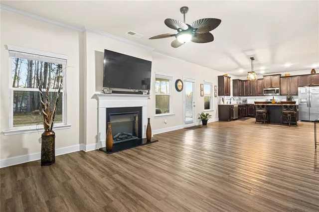 a view of a living room a fireplace with a flat screen tv