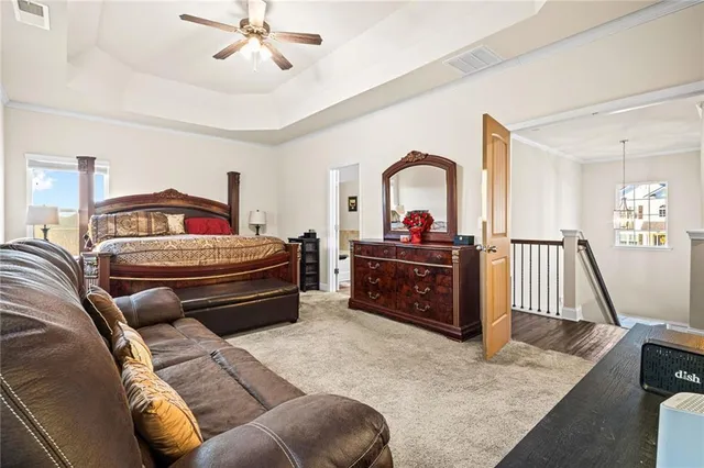 a bedroom with bed and a couch