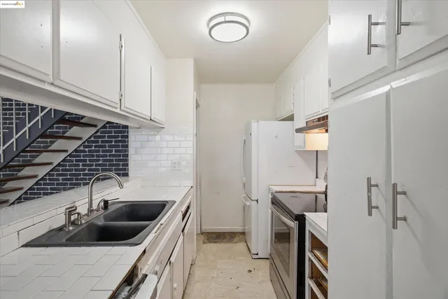 a kitchen with a sink and cabinets