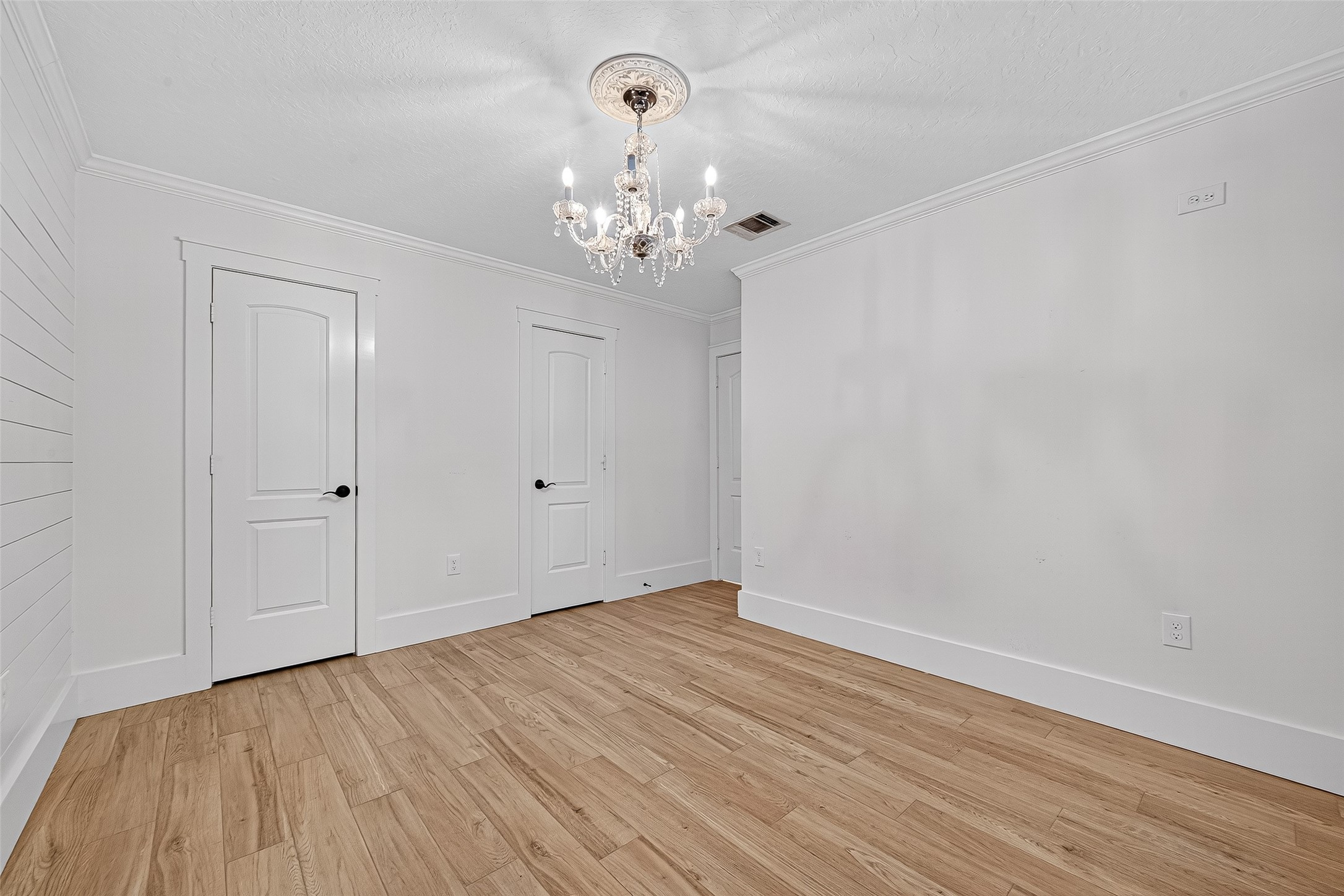 3115 Eula Morgan Road Katy, TX 77493 - Photo 21 of 36 a view of an empty room with wooden floor