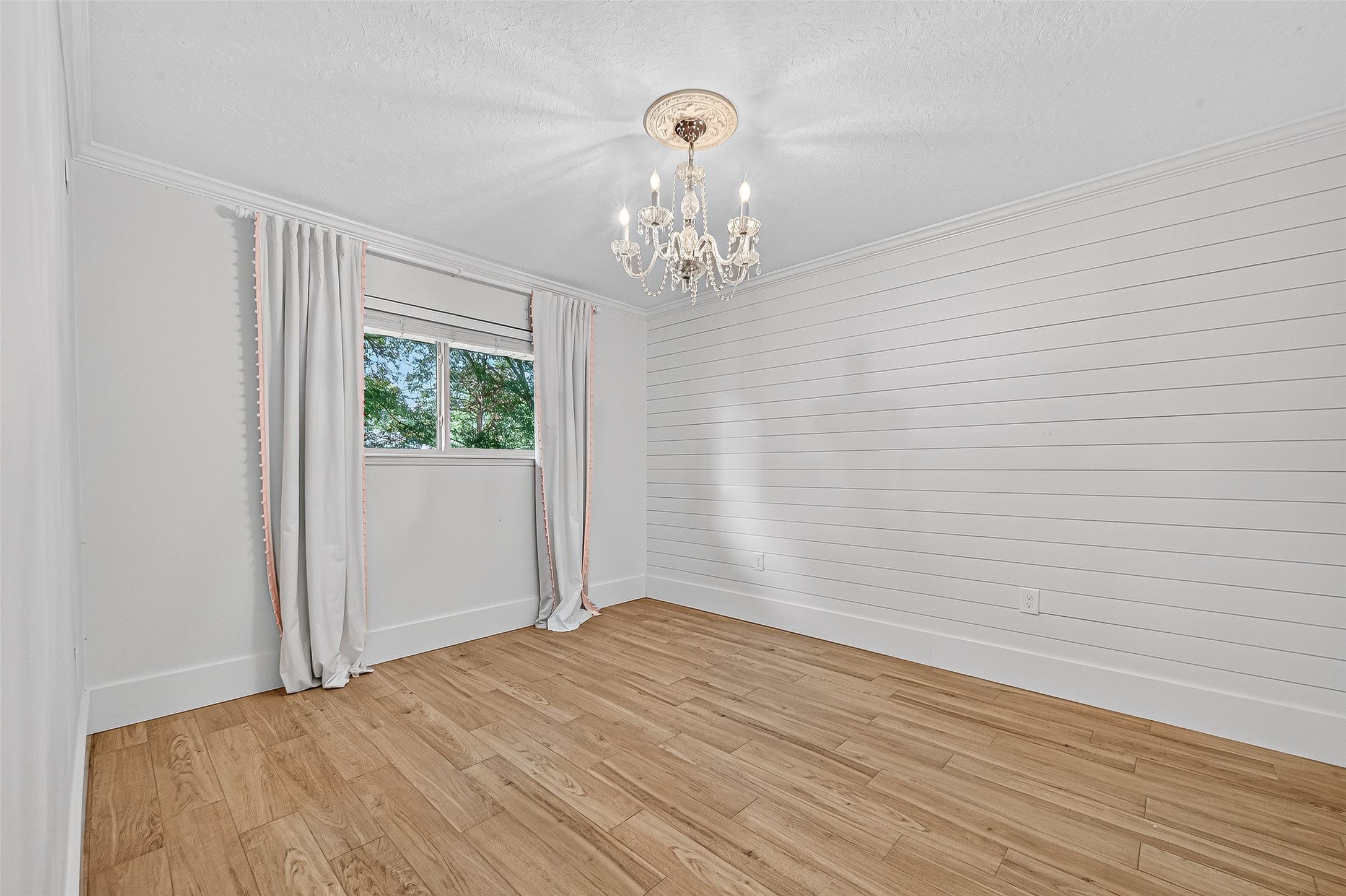 3115 Eula Morgan Road Katy, TX 77493 - Photo 24 of 36 a view of a chandelier fan and wooden floor