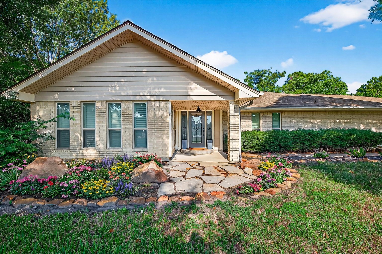3115 Eula Morgan Road Katy, TX 77493 - Photo 4 of 36 a front view of a house with a garden