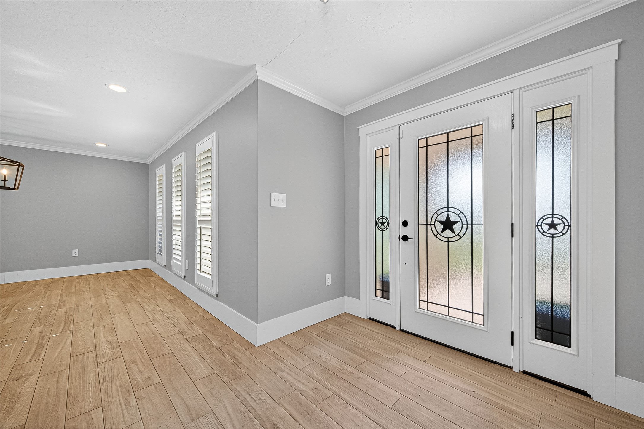3115 Eula Morgan Road Katy, TX 77493 - Photo 5 of 36 an empty room with wooden floor and windows