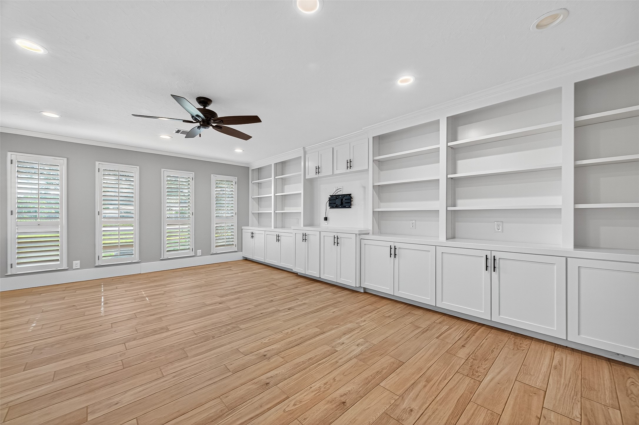 3115 Eula Morgan Road Katy, TX 77493 - Photo 6 of 36 a view of an empty room with a window and wooden floor