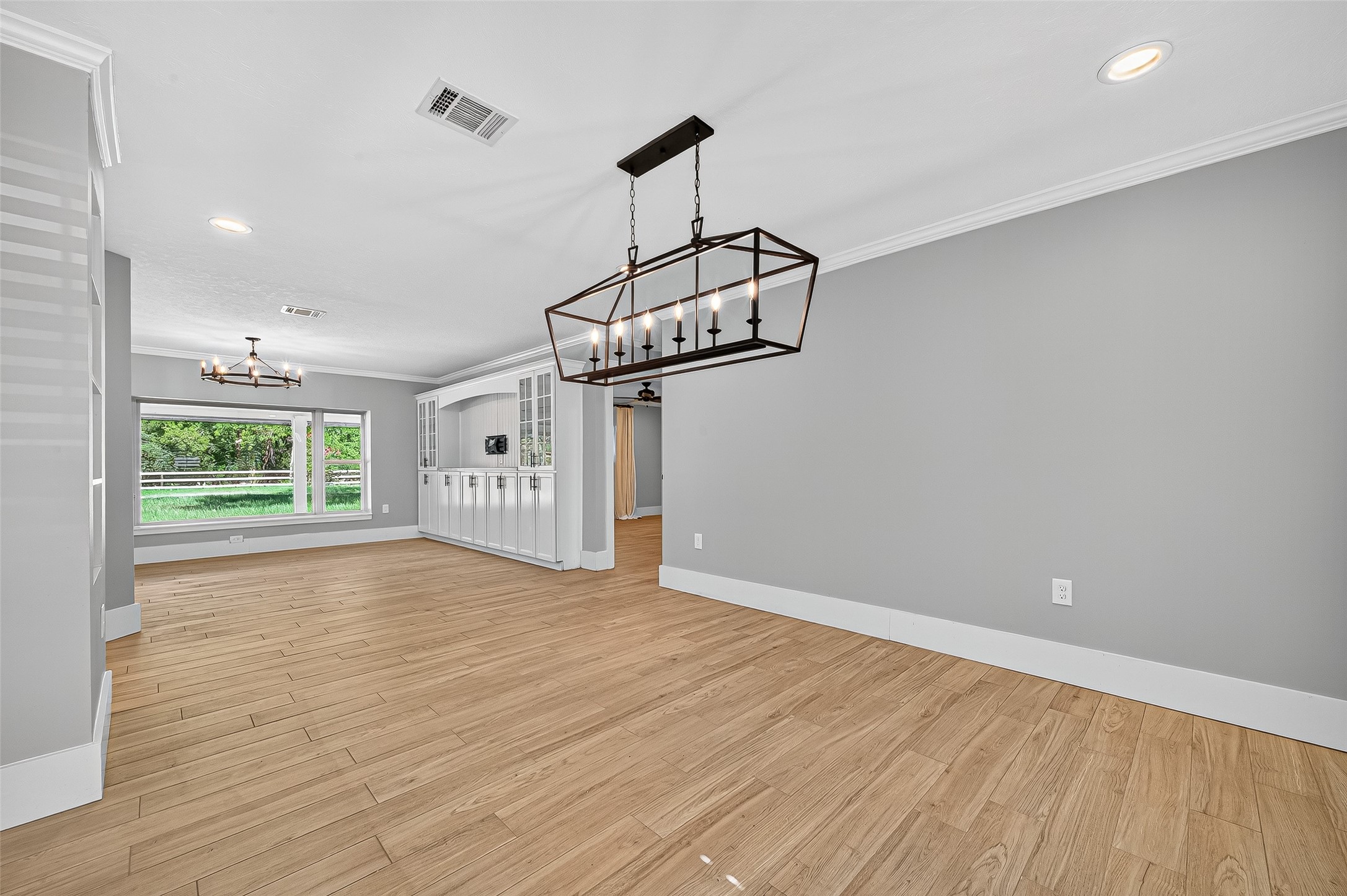 3115 Eula Morgan Road Katy, TX 77493 - Photo 8 of 36 a view of empty room with wooden floor and ceiling fan