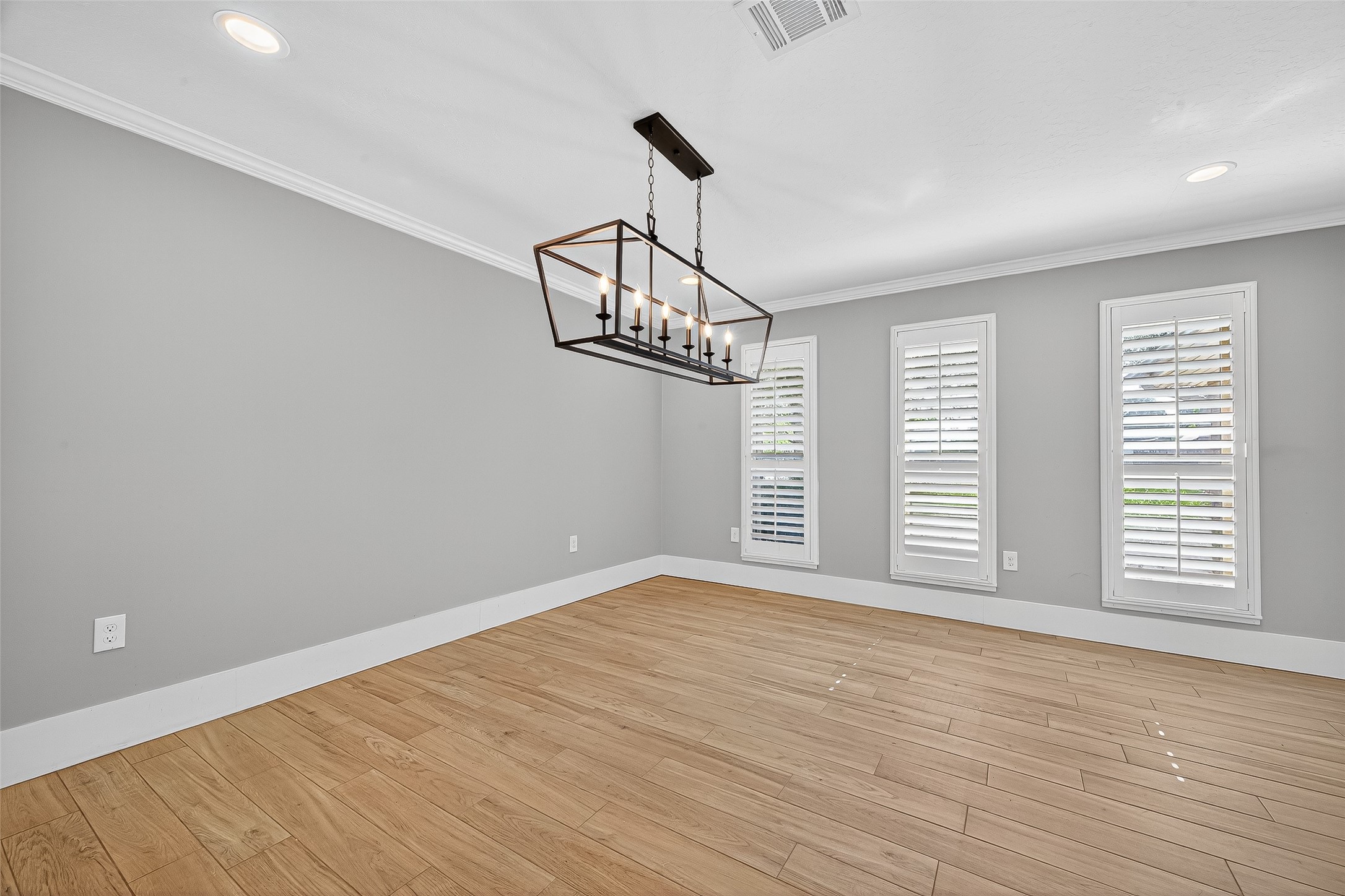 3115 Eula Morgan Road Katy, TX 77493 - Photo 9 of 36 a view of an empty room with wooden floor and a window