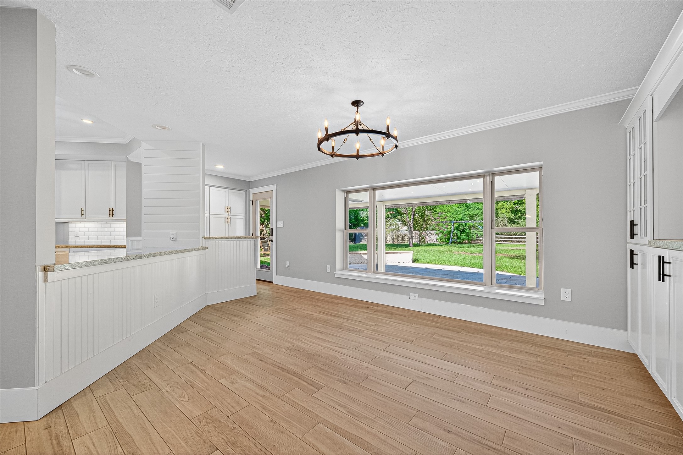 3115 Eula Morgan Road Katy, TX 77493 - Photo 10 of 36 a view of an empty room with wooden floor and a window