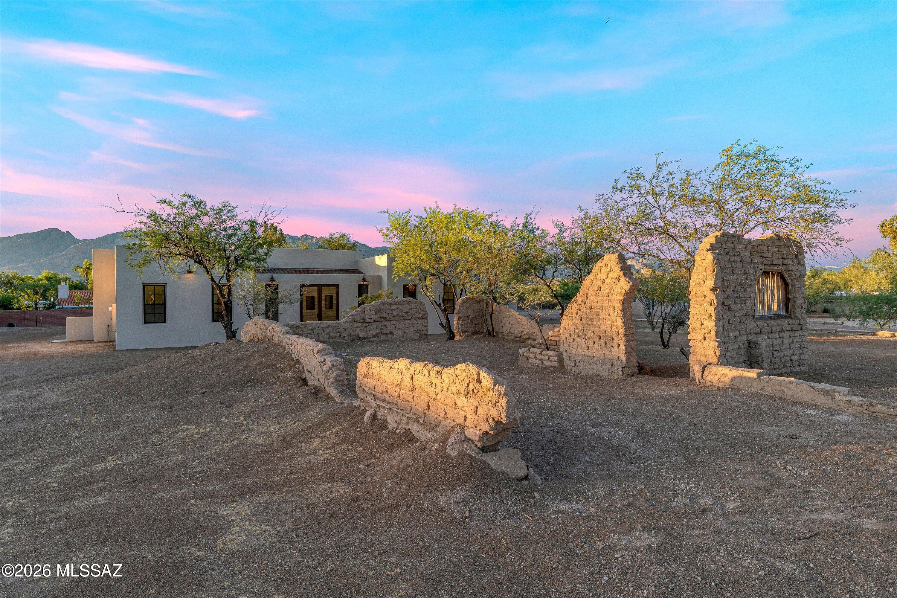5259 East Fort Lowell Road Tucson, AZ 85712 - Photo 3 of 50 a front view of a house with a yard and a garage