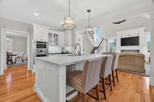 a kitchen with stainless steel appliances granite countertop a stove and refrigerator
