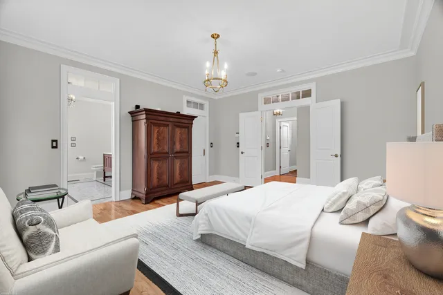 a bedroom with a bed furniture and a window