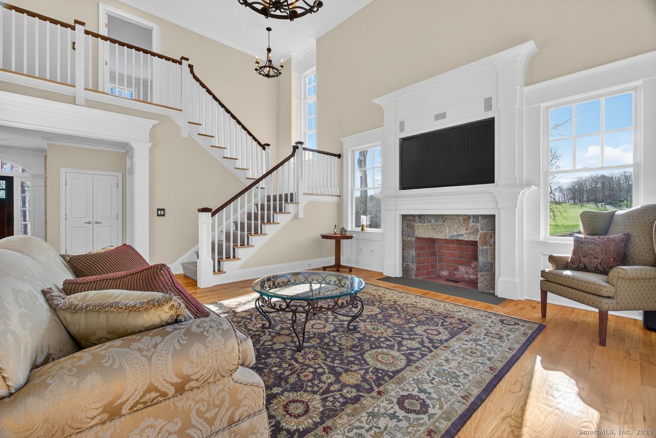 401 Fox Hopyard Road East Haddam, CT 06423 - Photo 22 of 38 a living room with furniture and a fireplace
