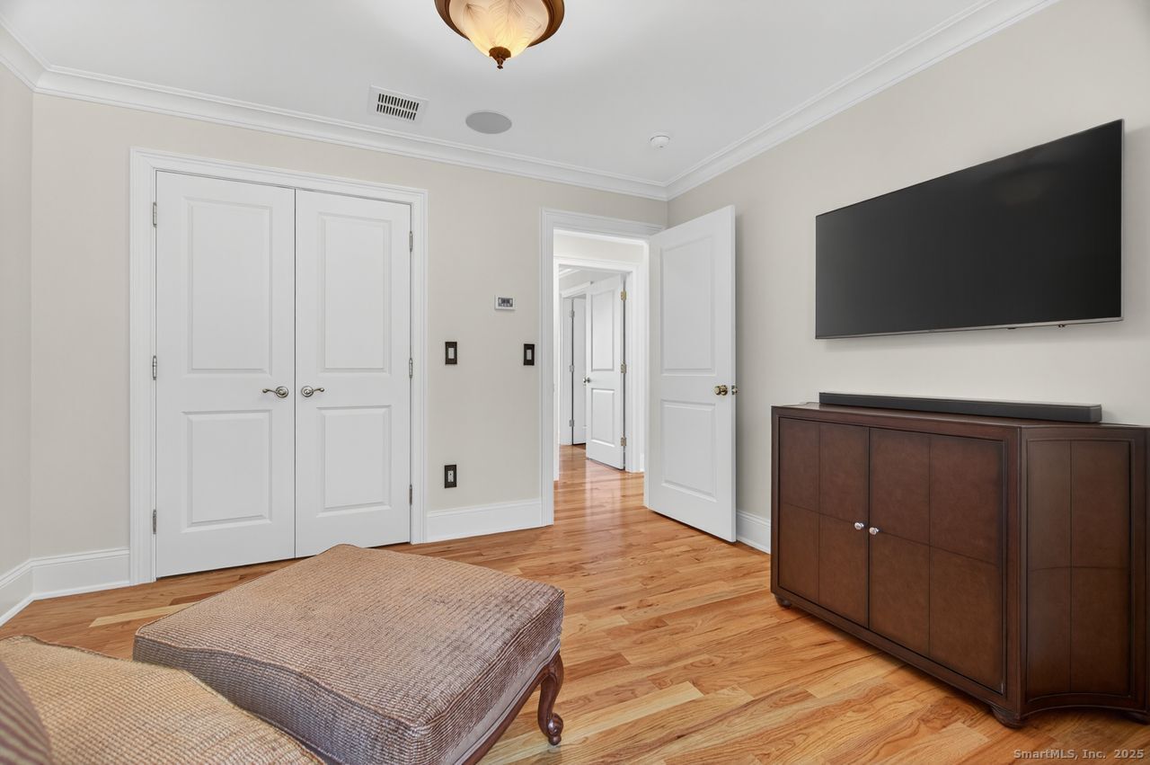 401 Fox Hopyard Road East Haddam, CT 06423 - Photo 29 of 38 a view of a livingroom with wooden floor and a flat screen tv