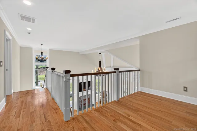 a view of room with hardwood floor and closet