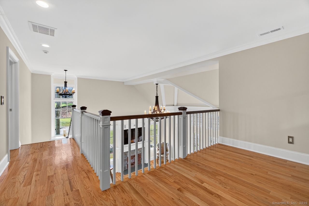 401 Fox Hopyard Road East Haddam, CT 06423 - Photo 30 of 38 a view of a hallway with wooden floor