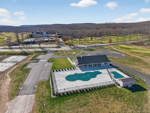 a view of swimming pool with a table and chairs