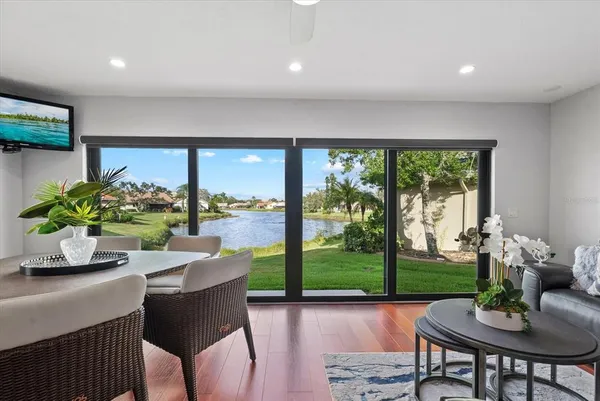 a view of a dining room with furniture window and wooden floor