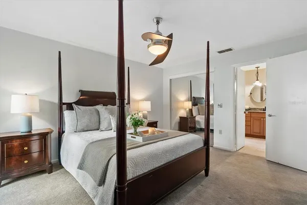 a bedroom with a bed and a closet