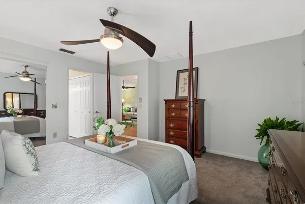 a bedroom with bed and window