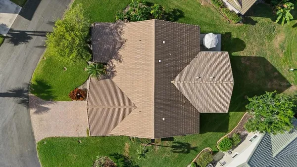 an aerial view of a house having yard