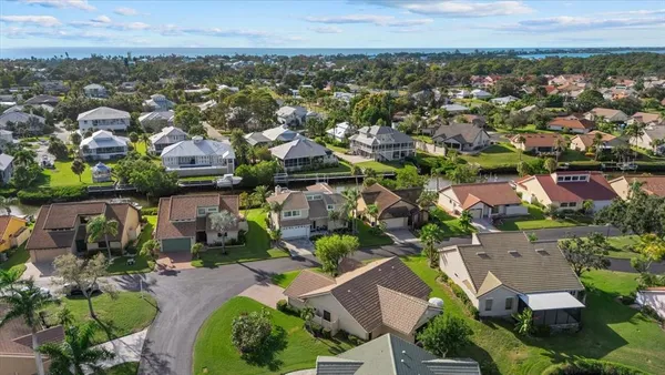 an aerial view of residential houses with outdoor space