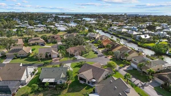 an aerial view of residential houses with outdoor space
