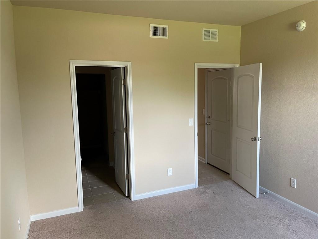 1420 Nevarez Kyle, TX 78640 - Photo 7 of 9 A well-maintained interior offers two entryways to adjoining spaces.