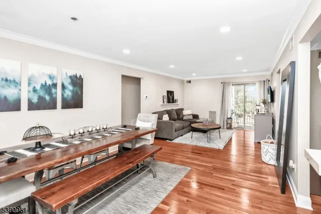 a living room with furniture a rug and a window