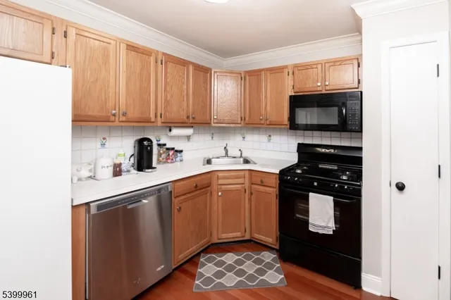 a kitchen with a sink stove and microwave