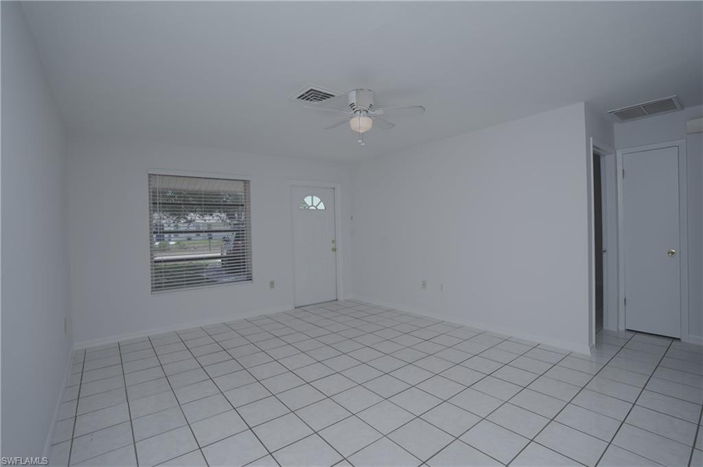 1195 South Alhambra Circle Naples, FL 34103 - Photo 16 of 34 a view of an empty room and window