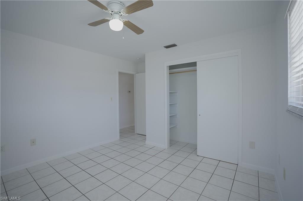 1195 South Alhambra Circle Naples, FL 34103 - Photo 19 of 34 a view of an empty room and window