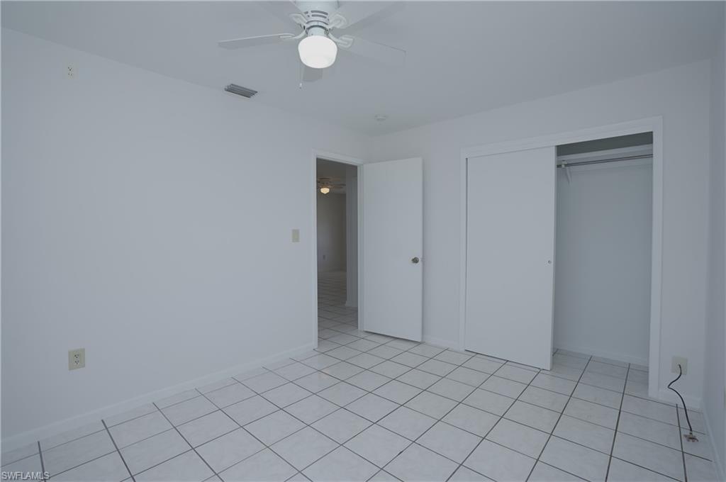 1195 South Alhambra Circle Naples, FL 34103 - Photo 21 of 34 a view of an empty room and window