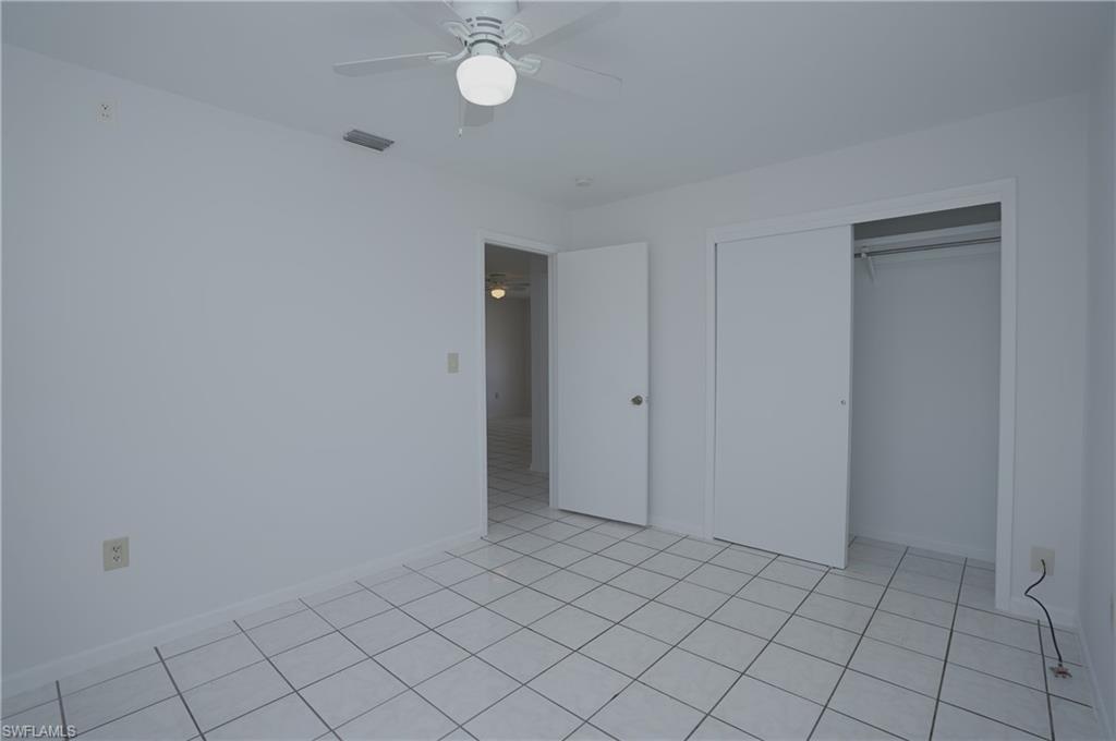 1195 South Alhambra Circle Naples, FL 34103 - Photo 22 of 34 a view of an empty room and window