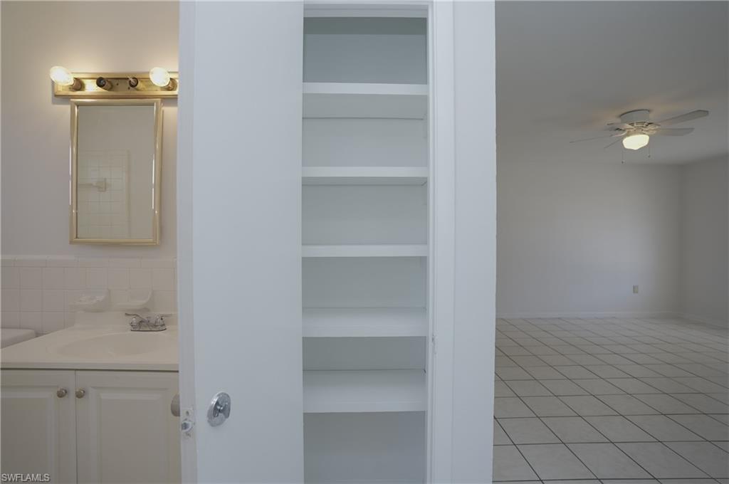 1195 South Alhambra Circle Naples, FL 34103 - Photo 25 of 34 a view of an empty walk in closet