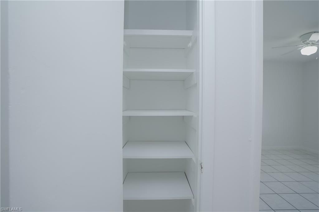 1195 South Alhambra Circle Naples, FL 34103 - Photo 26 of 34 a view of an empty walk in closet