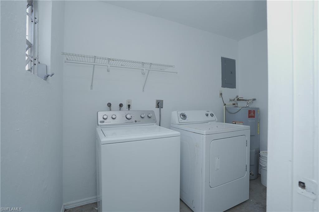 1195 South Alhambra Circle Naples, FL 34103 - Photo 30 of 34 a utility room with dryer and washer