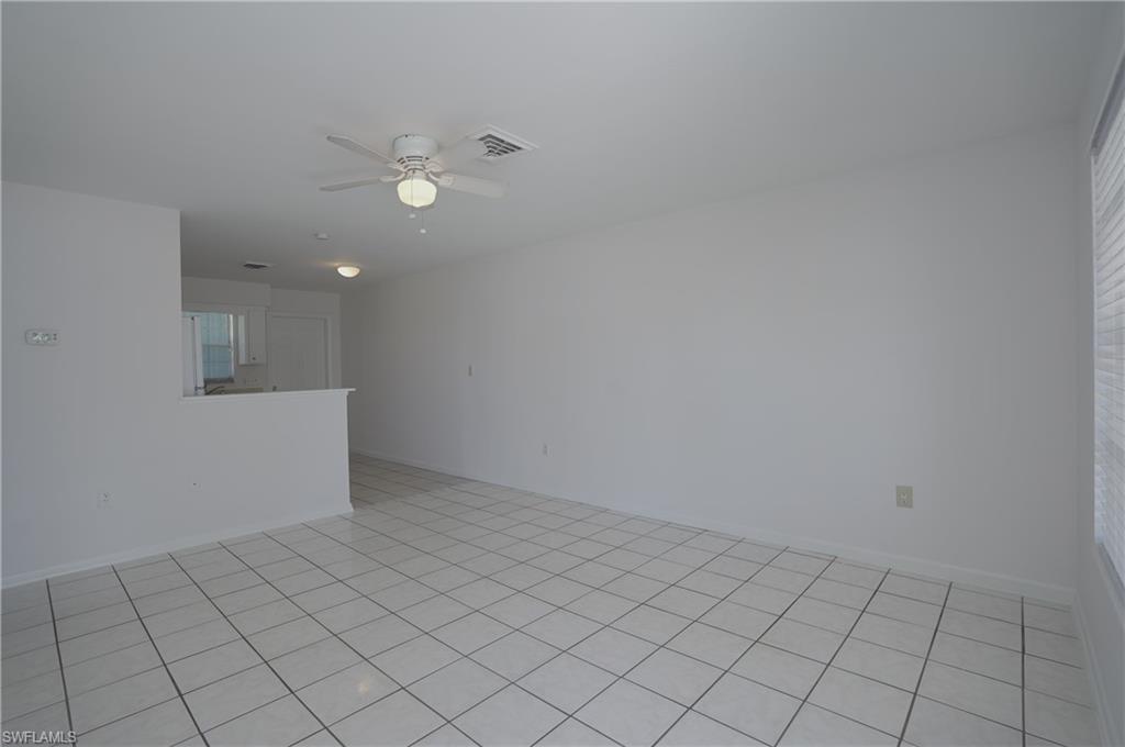1195 South Alhambra Circle Naples, FL 34103 - Photo 6 of 34 wooden floor in an empty room