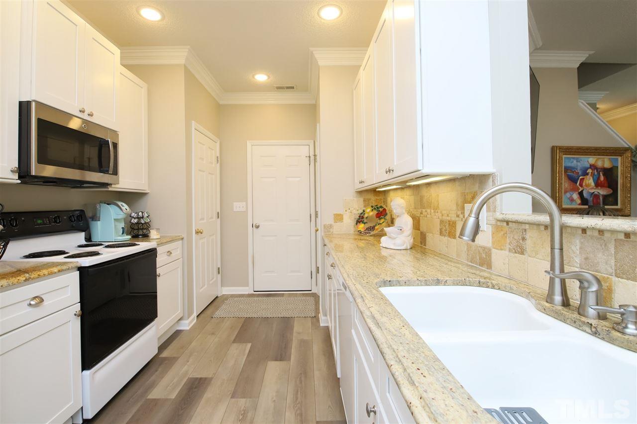 2412 Pumpkin Ridge Way Raleigh, NC 27604 - Photo 12 of 30 another angle of beautiful kitchen leading to amazing garage
