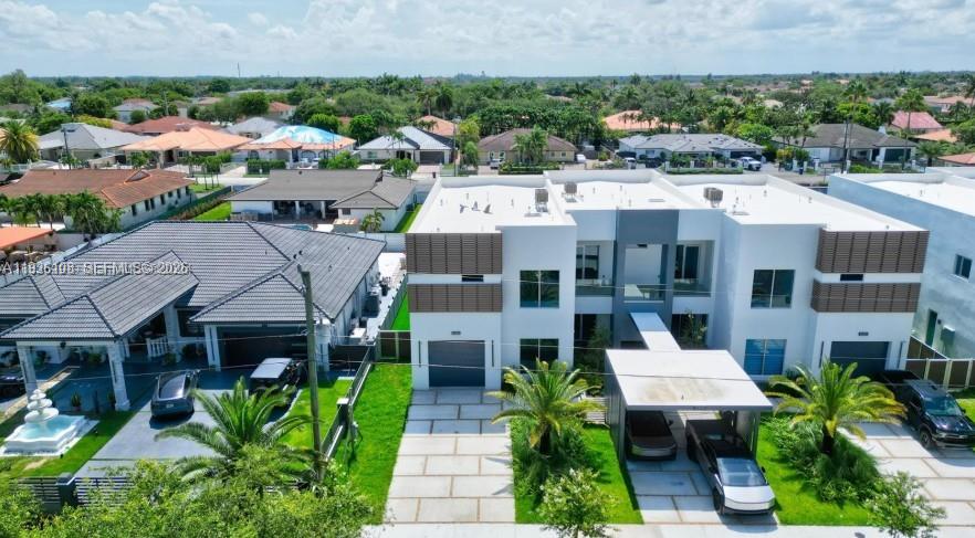 3904 Southwest 137th Court Miami, FL 33175 - Photo 2 of 7 a aerial view of a house with plants and large trees
