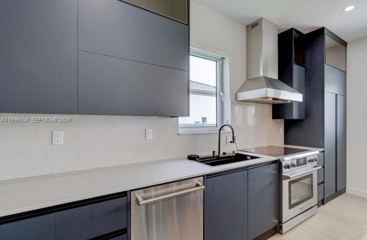 3904 Southwest 137th Court Miami, FL 33175 - Photo 3 of 7 a kitchen with stainless steel appliances a sink stove and refrigerator