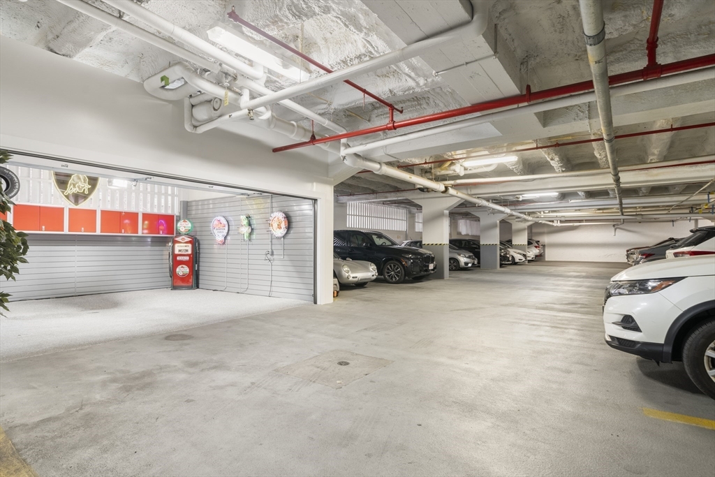 12 Stoneholm Street, Unit PKG:A Boston, MA 02115 - Photo 4 of 10 a view of parking garage with cars