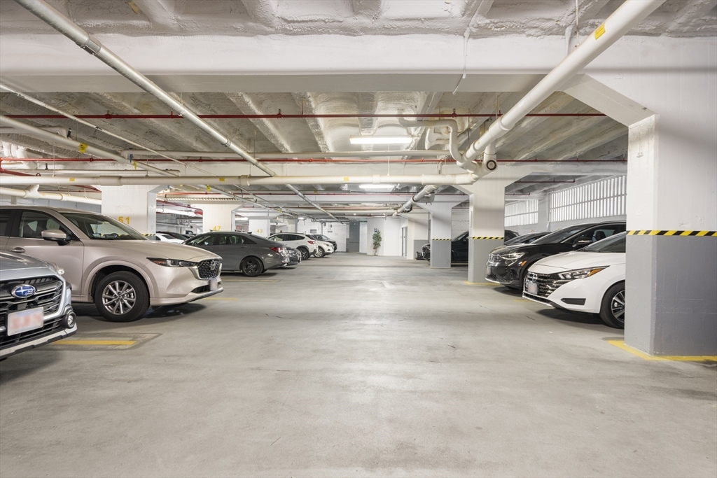12 Stoneholm Street, Unit PKG:A Boston, MA 02115 - Photo 6 of 10 a view of parking garage with cars parked